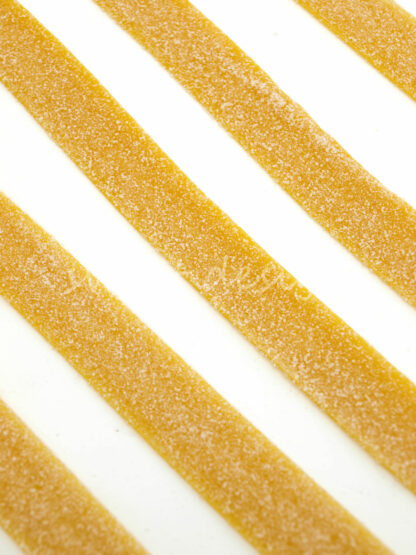 Tiras amarillas de limón con pica pica para hacer pasteles de chuches